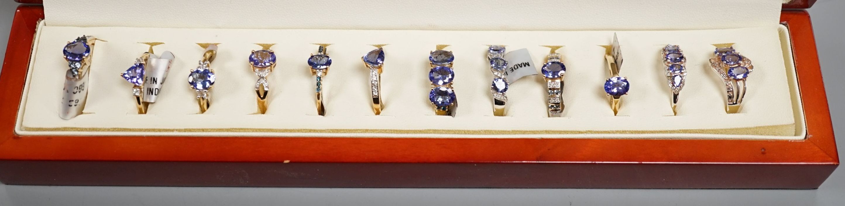 Nine assorted modern 9ct gold and tanzanite dress rings, one similar 14ct gold ring and two 925 and gem set rings